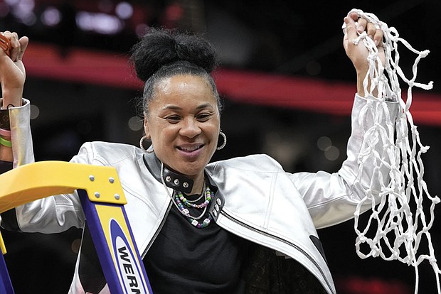 South Carolina head coach Dawn Staley cuts down the net after the Final Four college
basketball championship game against Iowa in the women’s NCAA Tournament, Sunday,
April 7, in Cleveland. South Carolina won 87-75.