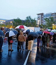 Attendees of the Taste of Mississippi event wait in line in the rain in Jackson, Mississippi.
Mandatory Credit:	Sarah Warnock/USA Today via CNN Newsource