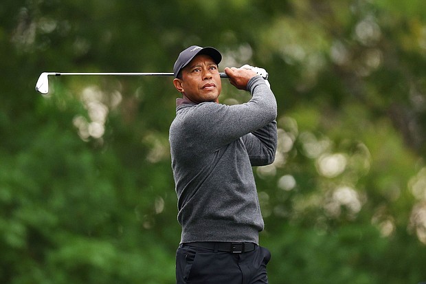 Tiger Woods of the United States plays his shot from the fourth tee during a practice round prior to the 2024 Masters Tournament at Augusta National Golf Club on April 09, in Augusta, Georgia.
Mandatory Credit:	Andrew Redington/Getty Images via CNN Newsour