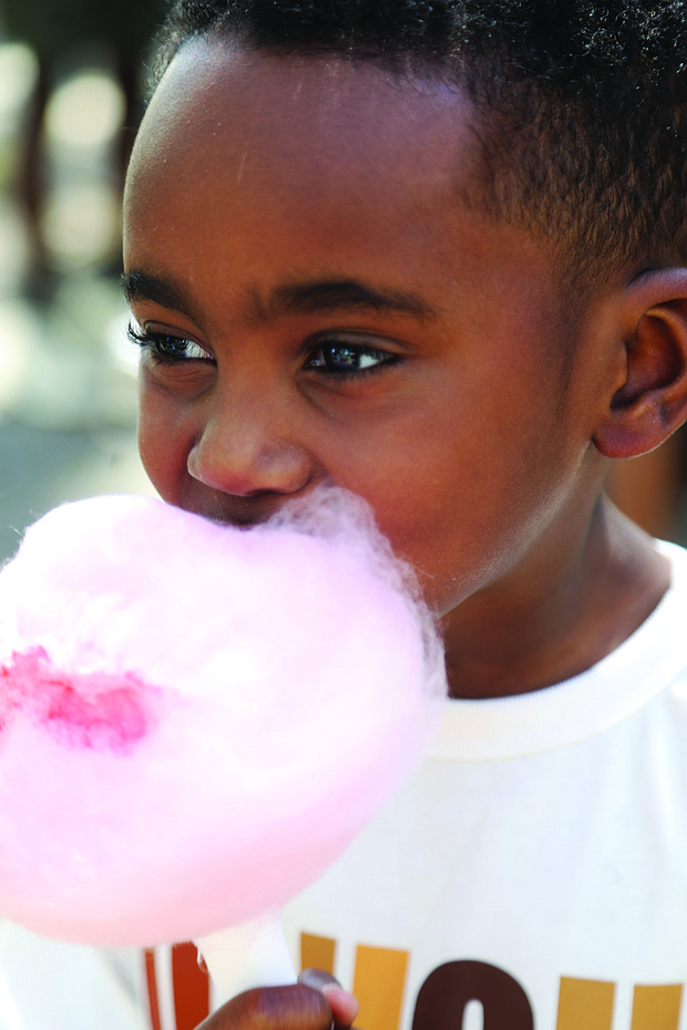 Cayson Marrow, 5, of Richmond is completely consumed by fresh cotton candy during the Birth in Color event, “Color Carnival” at Bryan Park as a part of the national celebration of Black Maternal
Health Week April 11-17.
Cayson attended the event with his mother, Curtisha Johnson and father Spencer Marrow.
