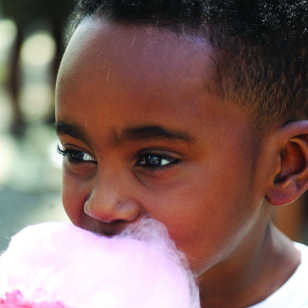 Cayson Marrow, 5, of Richmond is completely consumed by fresh cotton candy during the Birth in Color event, “Color Carnival” at Bryan Park as a part of the national celebration of Black Maternal
Health Week April 11-17.
Cayson attended the event with his mother, Curtisha Johnson and father Spencer Marrow.