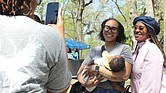 Monica Tolson, 30, of Chesterfield holds six-month-old Ishmael Hicks as his mom and their friend, India Hicks, enjoy a Birth in Color’s “Color Carnival” at Bryan Park. Birth in Color is a local reproductive justice organization dedicated to maternal and reproductive health, policy and removing biases for people of color. The event was part of the national celebration of Black Maternal Health Week April 11-17.