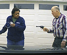 In this image taken from Uber dashcam video released by the Clark County, Ohio, Sheriff’s Office, William Brock, right, holds a weapon to Uber driver Loletha Hall outside his home in South Charleston, Ohio, on March 25, 2024.