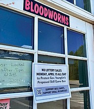 A sign posted outside a Henrico County convenience store informed customers that the business was not selling lottery tickets in protest of Gov. Glenn Youngkin’s tough approach to skill games.