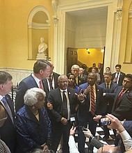 Virginia Gov. Glenn Youngkin, third from left, and legislative leaders speak to the media
inside the state Capitol on Wednesday, April 17.