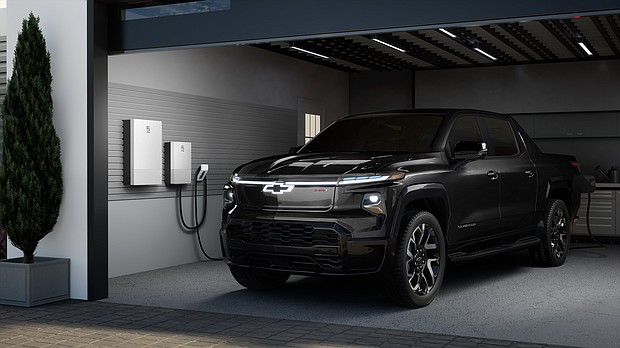 Rendering of a 2024 Chevrolet Silverado EV RST in a residential garage with anticipated GM Energy offerings. Simulated products shown. Actual production model may vary. Simulated vehicle shown. Actual production model may vary.