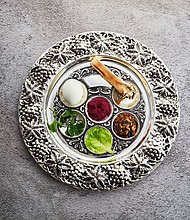 A silver engraved Passover Seder plate with horseradish in the center.
Mandatory Credit:	nambitomo/iStockphoto/Getty Images via CNN Newsource
