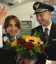 A captain proposed to a flight attendant aboard a flight to Kraków, Poland.
Mandatory Credit:	LOT Polish Airlines via Facebook via CNN Newsource