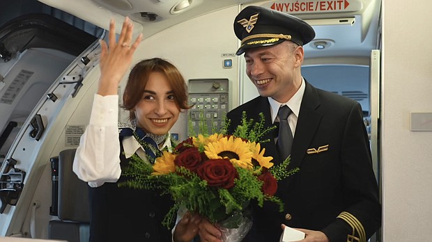 A captain proposed to a flight attendant aboard a flight to Kraków, Poland.
Mandatory Credit:	LOT Polish Airlines via Facebook via CNN Newsource