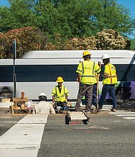 City of Richmond Department of Public Utilities, Mad Tec, and Richmond Gas Works employees collaborate on gas line repairs at the intersection of Belvidere Street and Idlewood Avenue in Richmond last week.