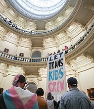 Equality Texas leadership drops a banner in the Capitol rotunda as LGBTQ rights activists protest SB14 at the Capitol of Texas in May 2023. The state of Texas is suing the Biden administration over recently announced federal protections for LGBTQ+ students.
Mandatory Credit:	Mikala Compton/American-Statesman/USA Today Network via CNN Newsource
