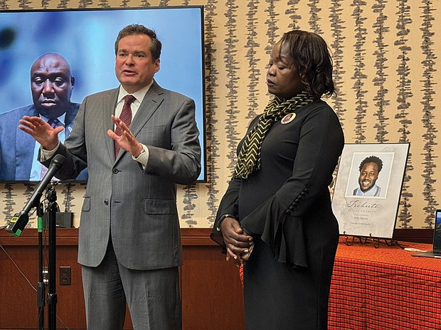 Caroline Ouko (left), the mother of 28-year-old Irvo Otieno, listens as her attorney, Mark Krudys, responds to Commonwealth Attorney Amanda Mann’s decision to dismiss charges against five of the eight criminal defendants charged with Mr. Otieno’s murder. Ms. Ouko also is represented by attorney Ben Crump, who spoke virtually at the press conference.