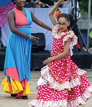 The festival, hosted by the Virginia Hispanic Chamber of Commerce, celebrates Hispanic and Latin American culture. Anaya Simms, 10 (left) and Vivian,
9 (right) perform with The Latin Ballet of Virginia.