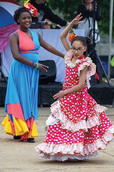 The festival, hosted by the Virginia Hispanic Chamber of Commerce, celebrates Hispanic and Latin American culture. Anaya Simms, 10 (left) and Vivian,
9 (right) perform with The Latin Ballet of Virginia.