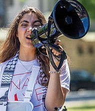 Sereen Haddad, a second-year student at Virginia Commonwealth University (VCU), addresses a crowd during a protest on Thursday, May 2, outside VCU’s James Branch Cabell Library. She and others shared recollections regarding events on Monday, April 29, when VCU deployed police at a pro-Palestinian protest.