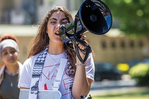 Sereen Haddad, a second-year student at Virginia Commonwealth University (VCU), addresses a crowd during a protest on Thursday, May 2, outside VCU’s James Branch Cabell Library. She and others shared recollections regarding events on Monday, April 29, when VCU deployed police at a pro-Palestinian protest.