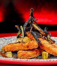 “Smoked Fire Wood” BBQ-spiced IMPOSSIBLE chicken will be at Elemental Table inspired by Disney and Pixar’s “Elemental” at Disney California Adventure Park in Anaheim, Calif. - with hot mustard sauce, pickles and charred onions. Available beginning May 10, 2024. (David Nguyen/Disneyland Resort)