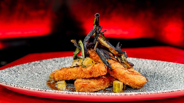 “Smoked Fire Wood” BBQ-spiced IMPOSSIBLE chicken will be at Elemental Table inspired by Disney and Pixar’s “Elemental” at Disney California Adventure Park in Anaheim, Calif. - with hot mustard sauce, pickles and charred onions. Available beginning May 10, 2024. (David Nguyen/Disneyland Resort)