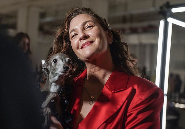 Drew Barrymore holds dog influencer Tika the Iggy during an interview in 2022. Barrymore adores animals. She said she wept the most writing her memoir “Wildflower” when she shared a story about her beloved dog, Flossie, who lived to be almost 17.
Mandatory Credit:	Bebeto Matthews/AP via CNN Newsource