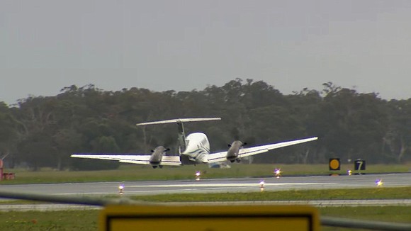 Two passengers and a pilot emerged unscathed from a small plane after it was forced to land without landing gear …