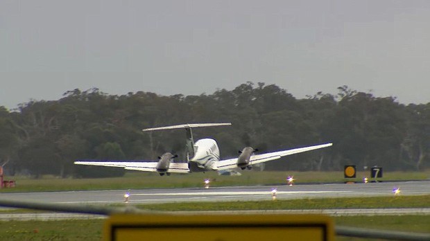 A plane makes successful wheels-up emergency landing in Newcastle, Australia after circling airport for hours, on May 13.
Mandatory Credit:	Nine News via CNN Newsource