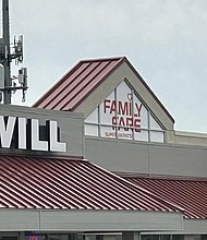 Police removed a woman from the covered sign atop the Family Fare supermarket in Midland.
Mandatory Credit:	WJRT via CNN Newsource