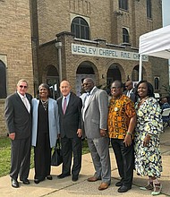 Community leaders at the honorary street marker dedication at the intersection of Emancipation Avenue and Webster Street, the historic site of Wesley Chapel African Methodist Episcopal (A.M.E.) Church,