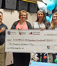 Education Foundation of Harris County Director Trina Silva, second from right, poses with Humble Independent School District representatives on May 10 after EFHC awarded a $10,000 Partners in Education grant to the district for a STEM for All Camp.
