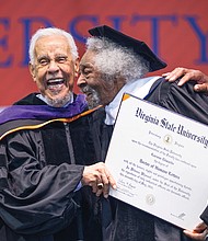 Lucious Edwards, Jr. shakes hands with L. Douglas Wilder after Mr. Edwards received an Honorary Doctorate Humane Letters during Virginia State University’s Spring Commencement ceremony in recognition of his service to VSU.