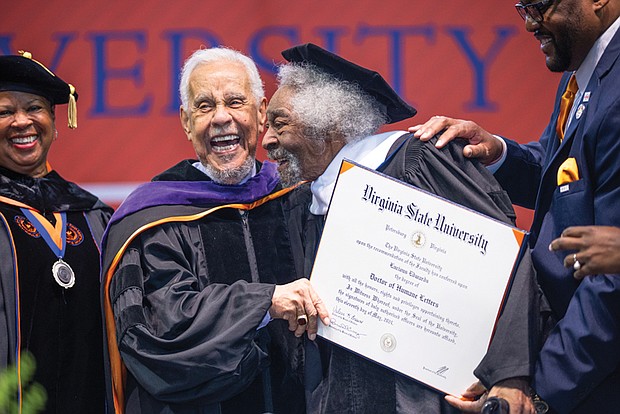 Lucious Edwards, Jr. shakes hands with L. Douglas Wilder after Mr. Edwards received an Honorary Doctorate Humane Letters during Virginia State University’s Spring Commencement ceremony in recognition of his service to VSU.