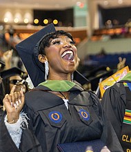 Alexis Renee Williams shows excitement at graduation.