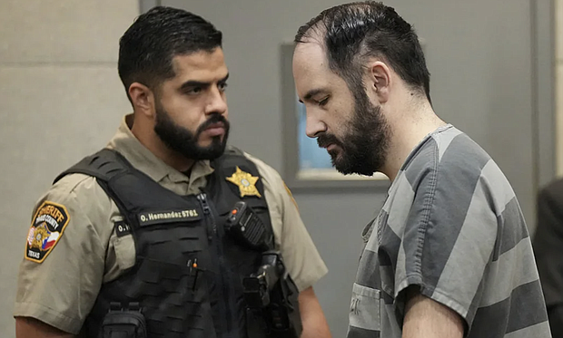 Daniel Perry returns to his chair after being sentenced to 25 years for the murder of Garrett Foster at the Blackwell-Thurman Criminal Justice Center in Austin, Texas, on Wednesday May 10, 2023. Jay Janner/Pool/Austin American-Statesman/AP/File