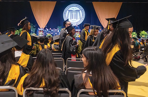 Over 100 Virginia Commonwealth University graduates walk out May 11 as Gov.
Glenn Youngkin delivers his 2024 Commencement address at the Greater Richmond
Convention Center.