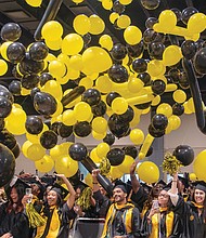 Graduates celebrate after receiving degrees at Virginia Commonwealth University at the Greater
Richmond Convention Center.