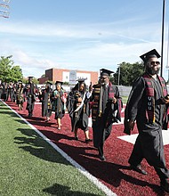 Virginia Union University’s undergraduates walk in and later turn their tassels symbolizing their transition from candidate to graduate during the 125th commencement exercises Saturday, May 11, the University’s campus.