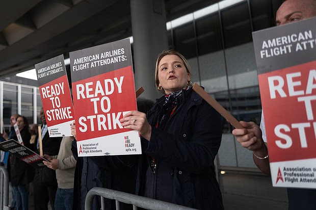 American Airlines flight attendants picket outside O’Hare International Airport to demand higher wages on May 9 in Chicago, Illinois. America's cost of living crisis has stung new flight attendants.
Mandatory Credit:	Scott Olson/Getty Images via CNN Newsource