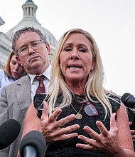 Rep. Marjorie Taylor Greene, R-Ga., joined by Rep. Thomas Massie, R-Ky., speaks to reporters after she tried and failed to oust House Speaker Mike Johnson at the Capitol in Washington, on May 8.
Mandatory Credit:	J. Scott Applewhite/AP via CNN Newsource