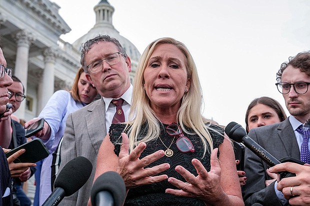 Rep. Marjorie Taylor Greene, R-Ga., joined by Rep. Thomas Massie, R-Ky., speaks to reporters after she tried and failed to oust House Speaker Mike Johnson at the Capitol in Washington, on May 8.
Mandatory Credit:	J. Scott Applewhite/AP via CNN Newsource