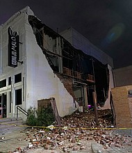 Felled bricks spill from a building after a severe thunderstorm hit downtown Houston on May 16.
Mandatory Credit:	David J. Phillip/AP via CNN Newsource