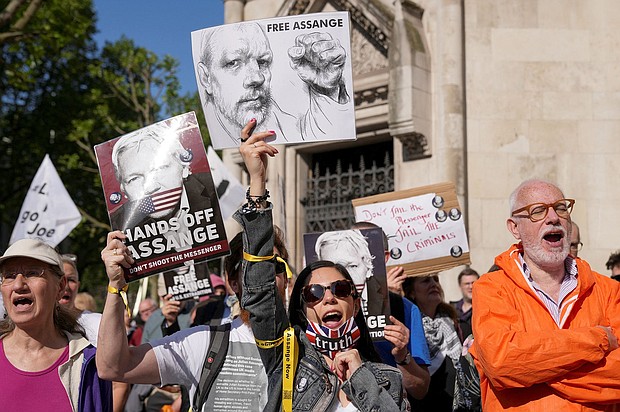 People attend a protest outside London's High Court before Julian Assange's extradition hearing on May 20.  A court hearing in which Assange will find out whether he can make a final challenge against his extradition to the United States is underway.
Mandatory Credit:	Maja Smiejkowska/Reuters via CNN Newsource