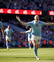 Phil Foden celebrates after scoring the opening goal for Manchester City.
Mandatory Credit:	Dave Thompson/AP via CNN Newsource