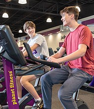 Teens using Exercise Bikes at Planet Fitness