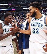 Anthony Edwards and Karl-Anthony Towns celebrate after winning Game 7.
Mandatory Credit:	C. Morgan Engel/Getty Images via CNN Newsource