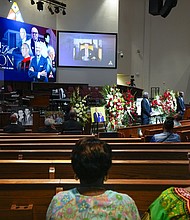 Mourners pay their respects for The Rev. William “Bill” Lawson in the sanctuary of the original Wheeler Avenue Baptist Church on Thursday, May 23, 2024 in Houston. Known for being a “Houston’s Pastor,” Lawson was the founding pastor of Wheeler Avenue Baptist Church who helped lead the Houston’s racial desegregation in the 1960s and continued to be a civil rights leader and spiritual guide throughout his life. He retired from the pulpit in 2004, but remained active in the church until his death on May 14 at age 95.