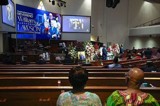Mourners pay their respects for The Rev. William “Bill” Lawson in the sanctuary of the original Wheeler Avenue Baptist Church on Thursday, May 23, 2024 in Houston. Known for being a “Houston’s Pastor,” Lawson was the founding pastor of Wheeler Avenue Baptist Church who helped lead the Houston’s racial desegregation in the 1960s and continued to be a civil rights leader and spiritual guide throughout his life. He retired from the pulpit in 2004, but remained active in the church until his death on May 14 at age 95.