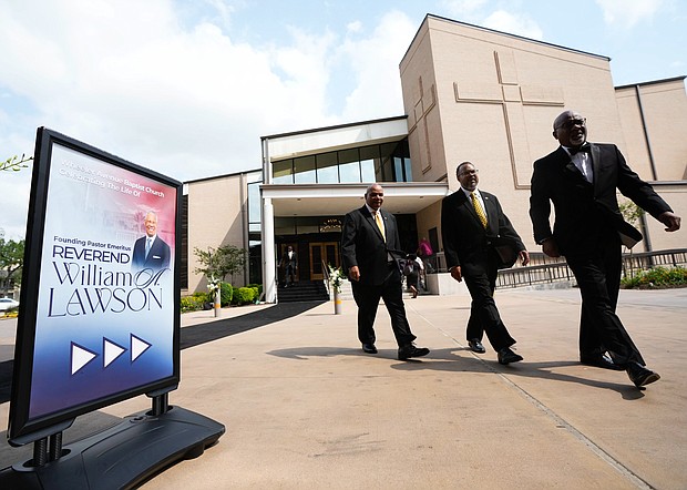 Members of the Alpha Phi Alpha fraternity walk outside the sanctuary of the original Wheeler Avenue Baptist Church before the community celebration for Rev. William “Bill” Lawson on Thursday, May 23, 2024, in Houston. Known for being a “Houston’s Pastor,” Lawson was the founding pastor of Wheeler Avenue Baptist Church who helped lead the Houston’s racial desegregation in the 1960s and continued to be a civil rights leader and spiritual guide throughout his life. He retired from the pulpit in 2004, but remained active in the church until his death on May 14 at age 95.