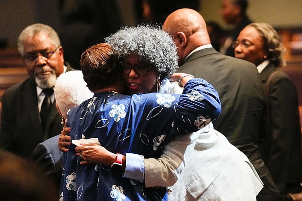 Mourners greet one another as they pay their respects for The Rev. William “Bill” Lawson in the sanctuary of the original Wheeler Avenue Baptist Church on Thursday, May 23, 2024, in Houston. Known for being a “Houston’s Pastor,” Lawson was the founding pastor of Wheeler Avenue Baptist Church who helped lead the Houston’s racial desegregation in the 1960s and continued to be a civil rights leader and spiritual guide throughout his life. He retired from the pulpit in 2004, but remained active in the church until his death on May 14 at age 95.