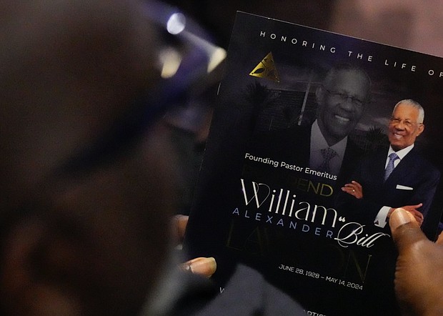 A program for a community celebration in honor of Rev. William “Bill” Lawson is seen at Wheeler Avenue Baptist Church on Thursday, May 23, 2024, in Houston. Known for being a “Houston’s Pastor,” Lawson was the founding pastor of Wheeler Avenue Baptist Church who helped lead the Houston’s racial desegregation in the 1960s and continued to be a civil rights leader and spiritual guide throughout his life. He retired from the pulpit in 2004, but remained active in the church until his death on May 14 at age 95.