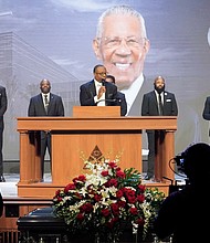 Pastor Marcus Cosby, center, speaks during a community celebration in honor of Rev. William “Bill” Lawson at Wheeler Avenue Baptist Church on Thursday, May 23, 2024, in Houston. Known for being a “Houston’s Pastor,” Lawson was the founding pastor of Wheeler Avenue Baptist Church who helped lead the Houston’s racial desegregation in the 1960s and continued to be a civil rights leader and spiritual guide throughout his life. He retired from the pulpit in 2004, but remained active in the church until his death on May 14 at age 95.
