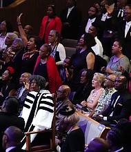 People react during a community celebration in honor of Rev. William “Bill” Lawson at Wheeler Avenue Baptist Church on Thursday, May 23, 2024, in Houston. Known for being a “Houston’s Pastor,” Lawson was the founding pastor of Wheeler Avenue Baptist Church who helped lead the Houston’s racial desegregation in the 1960s and continued to be a civil rights leader and spiritual guide throughout his life. He retired from the pulpit in 2004, but remained active in the church until his death on May 14 at age 95.